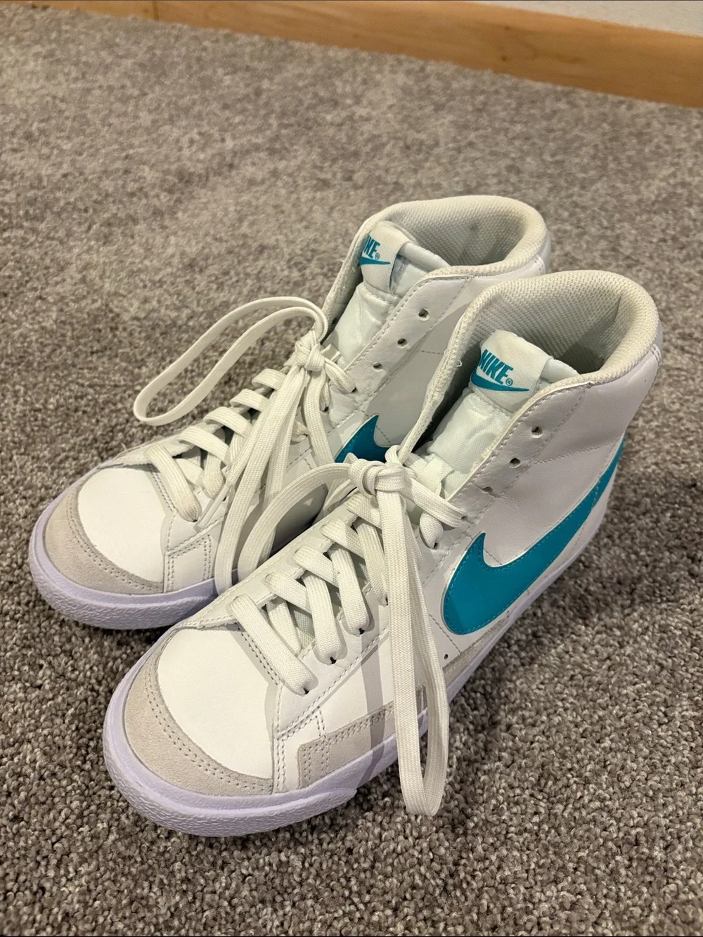 Nike White High-Top Sneakers with Teal Swoosh Accents